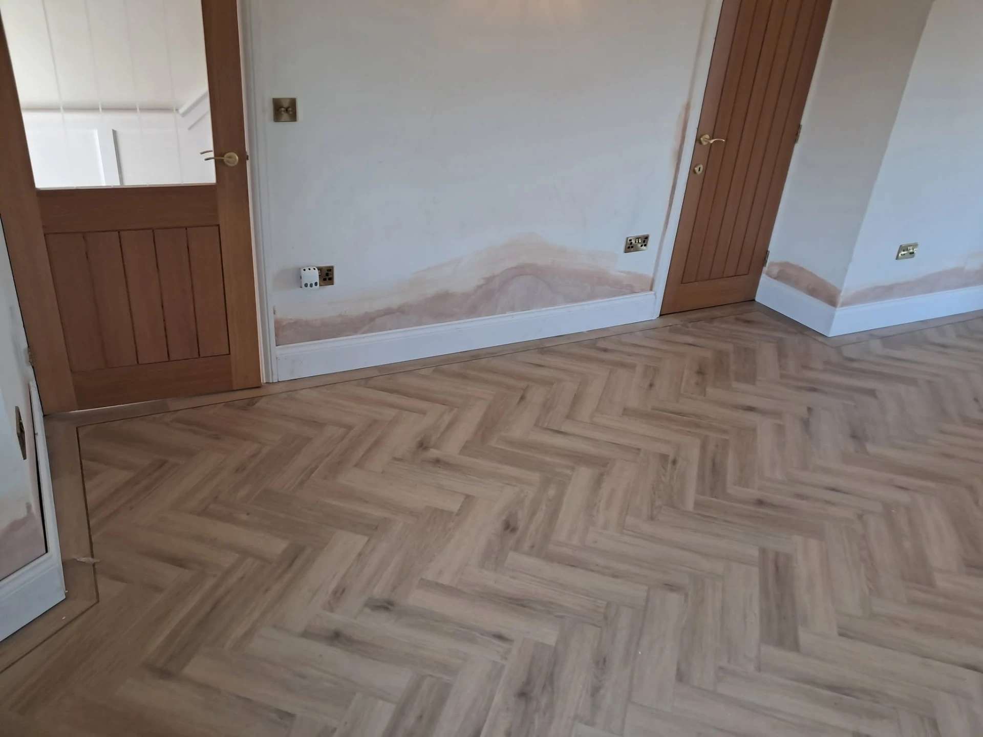 Herringbone flooring laid through a room