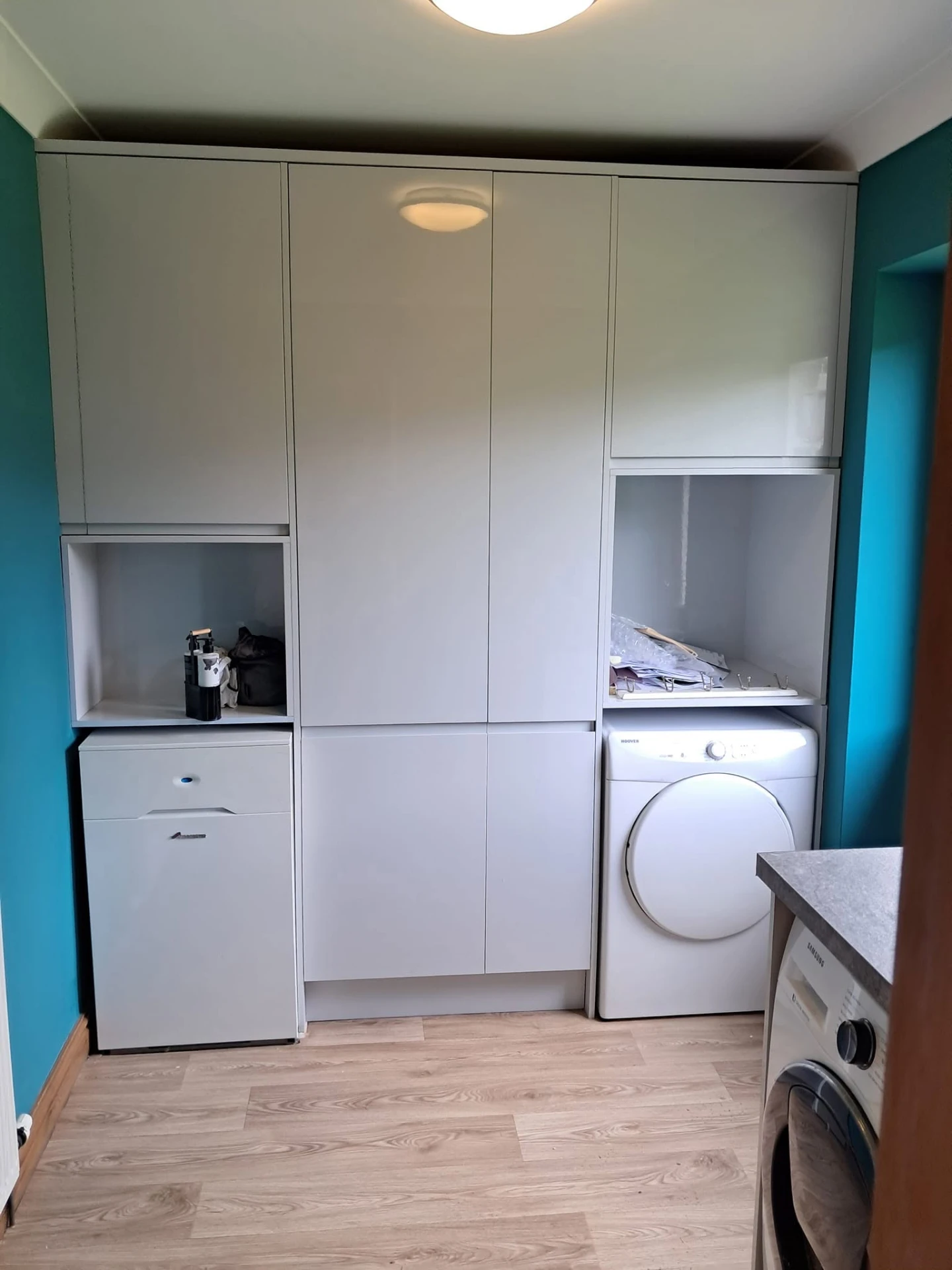 Fitted utility room units housing appliances
