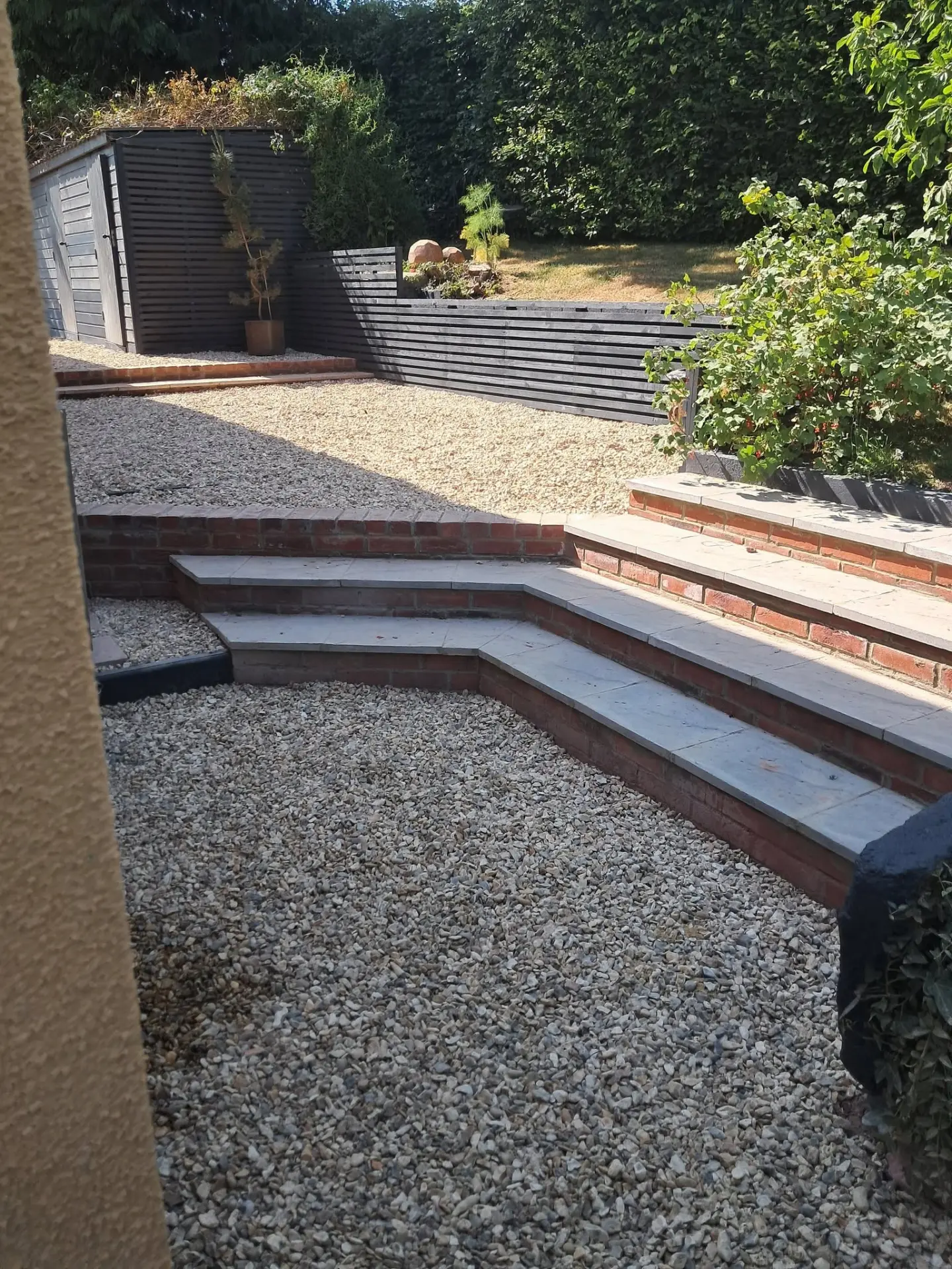 Garden steps with paving, brickwork and slatted fencing